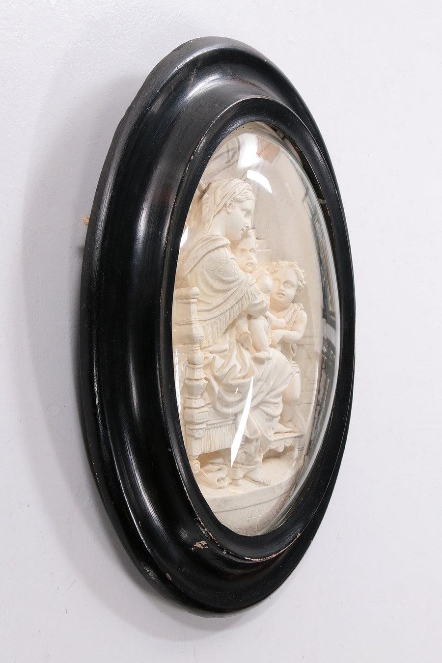 Old frame with meerschaum hand-carved Madonna and child, 1880 France

Statue in Oval Frame

This is a beautiful black frame made around 1880 with a beautiful carving in meerschaum (and soft rock).

The artwork is in excellent condition and could
