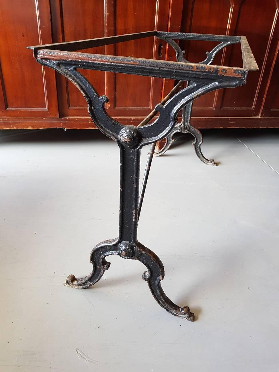 Large model old French cast-iron bistro table from the early 20th century.

The measurements are:
Depth 46 cm/ 18.1 inch.
Width 110 cm/ 43.3 inch.
Height 70 cm/ 27.5 inch.
 