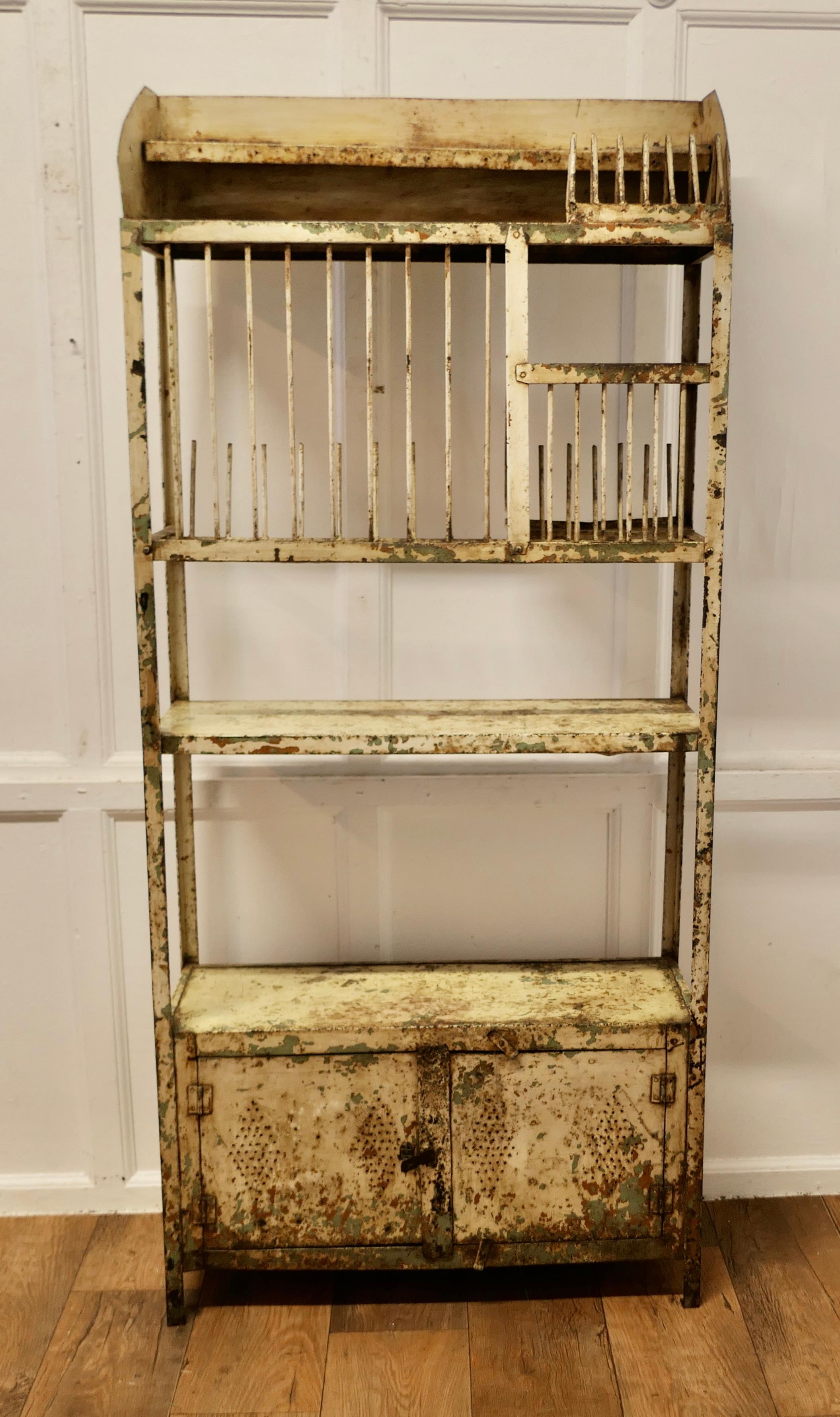 Old French Distressed Metal Field Kitchen Dresser, Drainer

Discovered in an old Barn, the dresser was used during the harvest time when there were many more workers to feed
The unit is made entirely with metal the patina is distressed but the