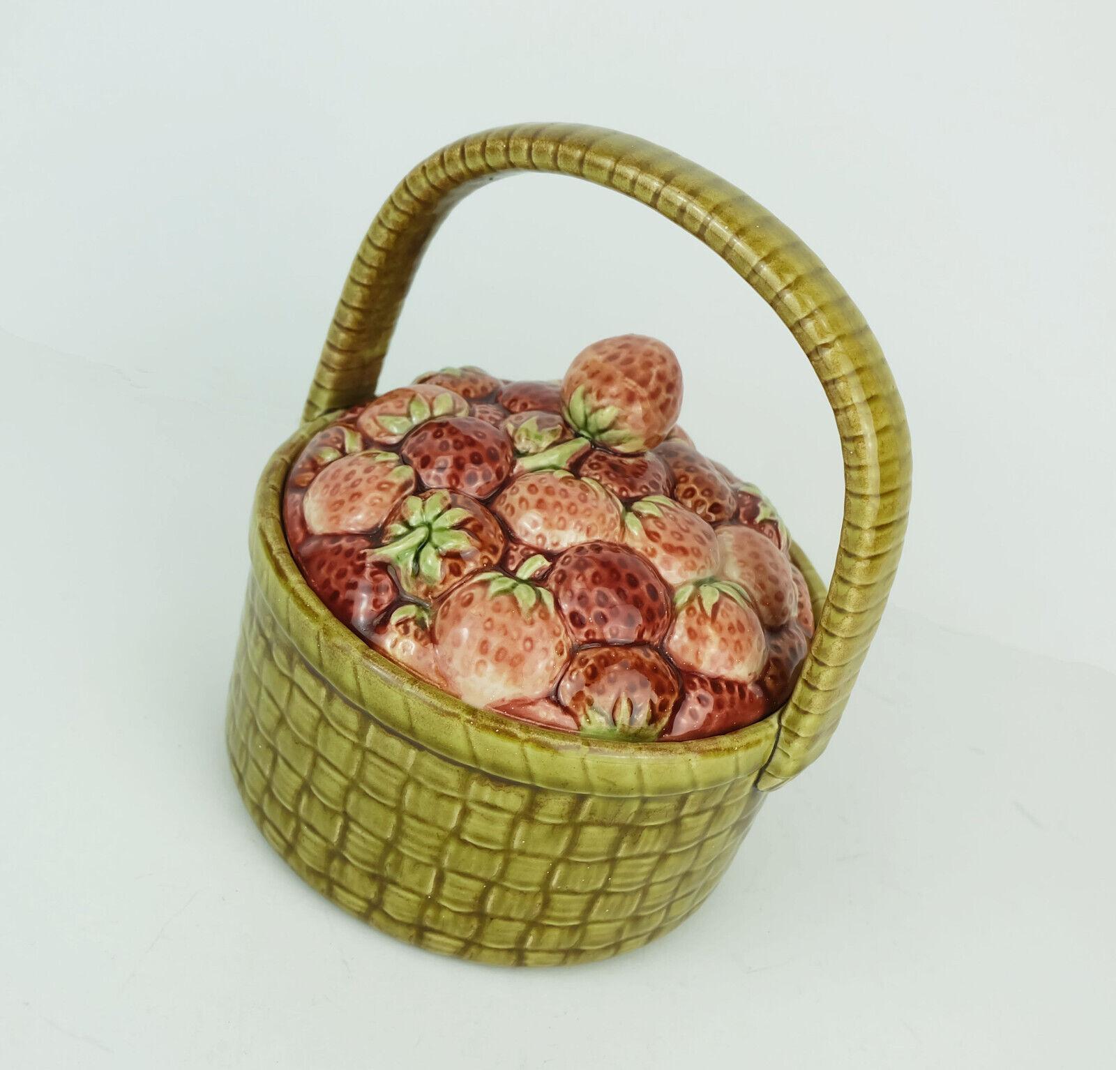 Very beautiful lidded ceramic jar, Sarreguemines France, around 1920s. Pot with basket surface, lid with strawberry decor.

Dimensions in cm: 
Height measured from bottom to rim 8,5 cm, total height with handle 20 cm, width 17 cm, depth 15