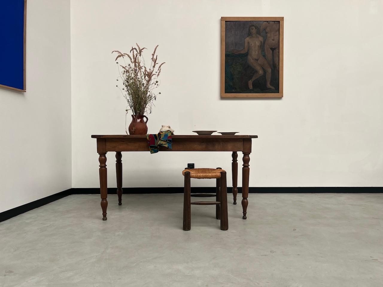 Very elegant bistro table from the 50s in solid walnut with turned legs. The veining of its top is sublime. With its drawer it is also functional. We have completely treated and varnished it for good daily protection.

Dimensions: L139.5 x D74 x