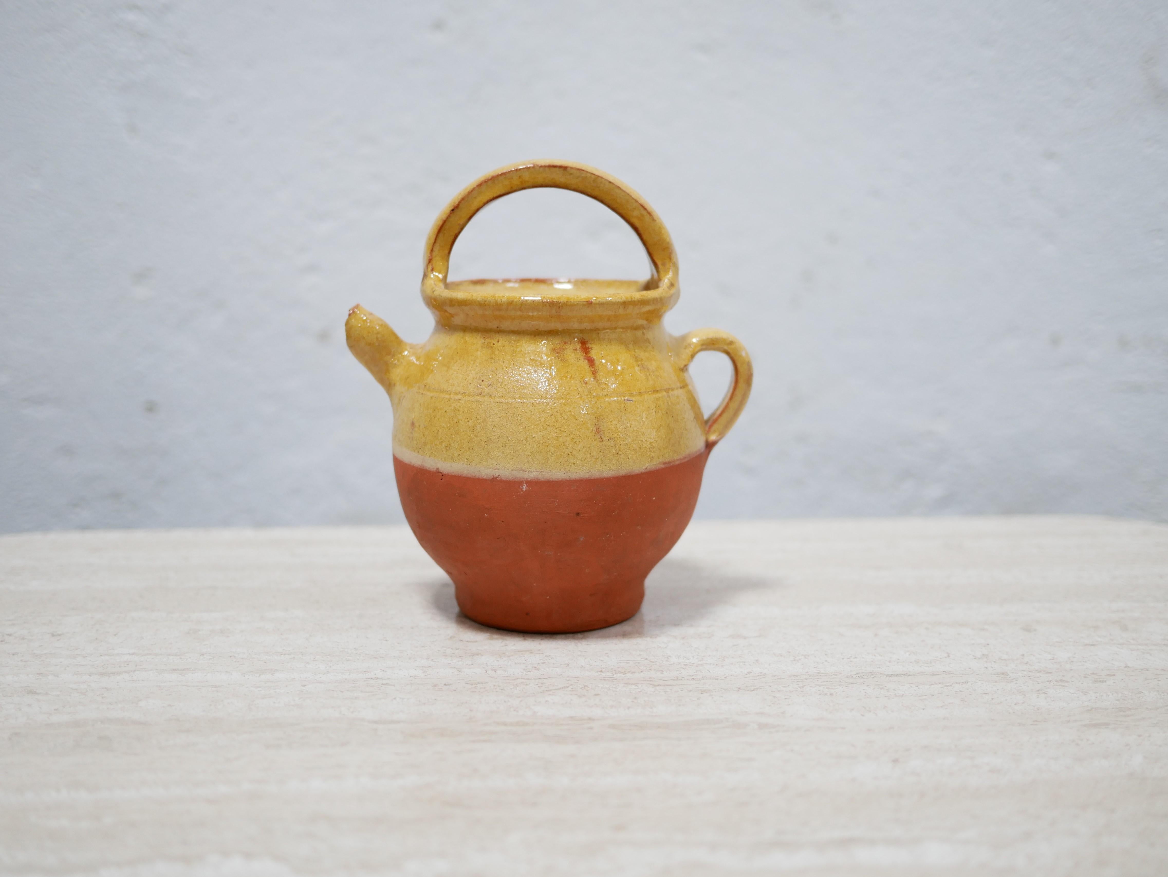 Small glazed terracotta pot designed in France in the 1950s.

With its modern shape and its pretty color, this ceramic will be perfect in a natural, refined and delicate decoration.
We can simply imagine it placed on a shelf or piece of