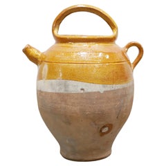 Old gargoulette pot in glazed terracotta