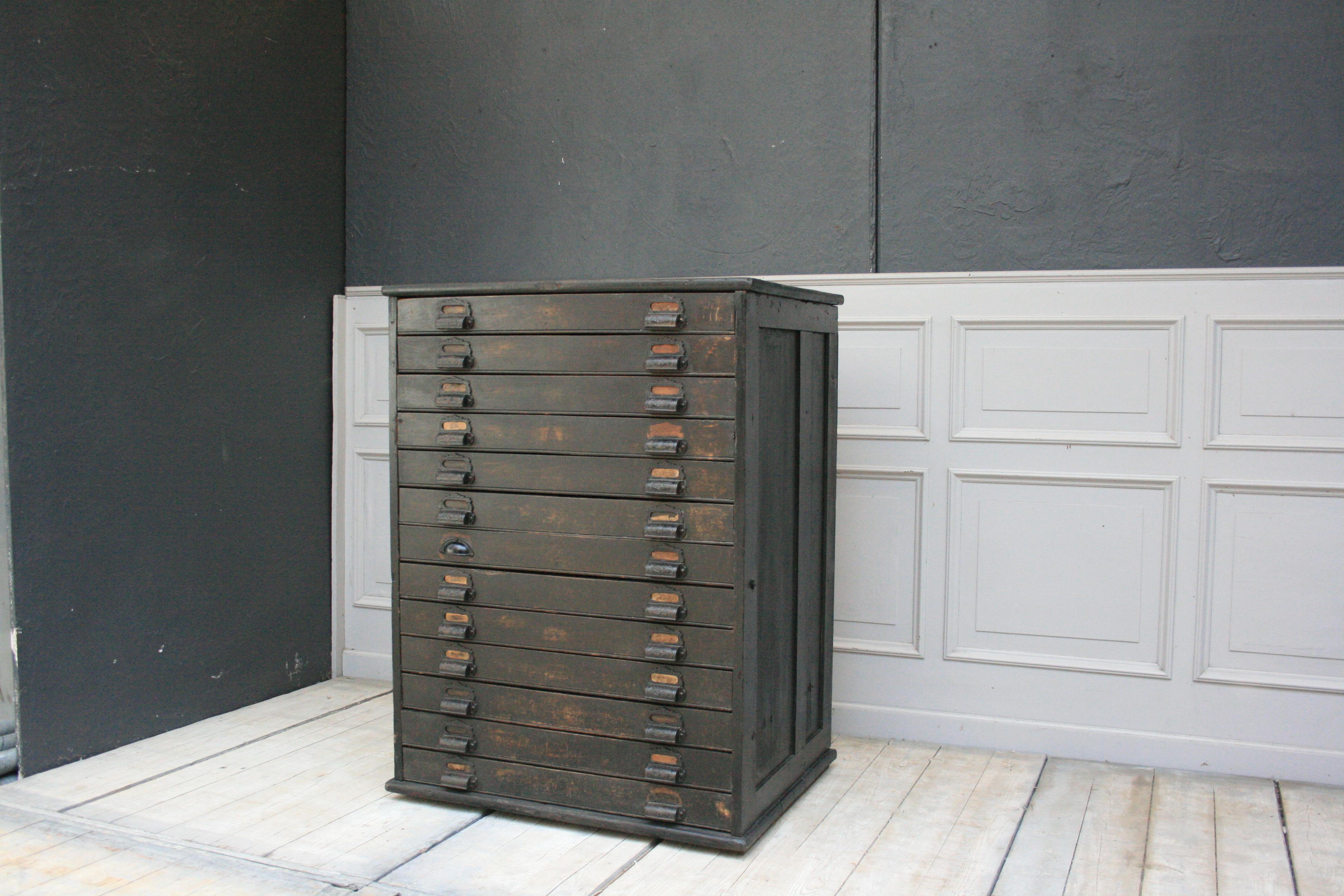 Old drawer cabinet / plan cabinet, with 13 drawers, from a German factory office. Refurbished and expertly shortened in depth, so that it is now useful in the living room. 

Dimensions: 117 cm high, 87 cm wide, 66 cm deep.