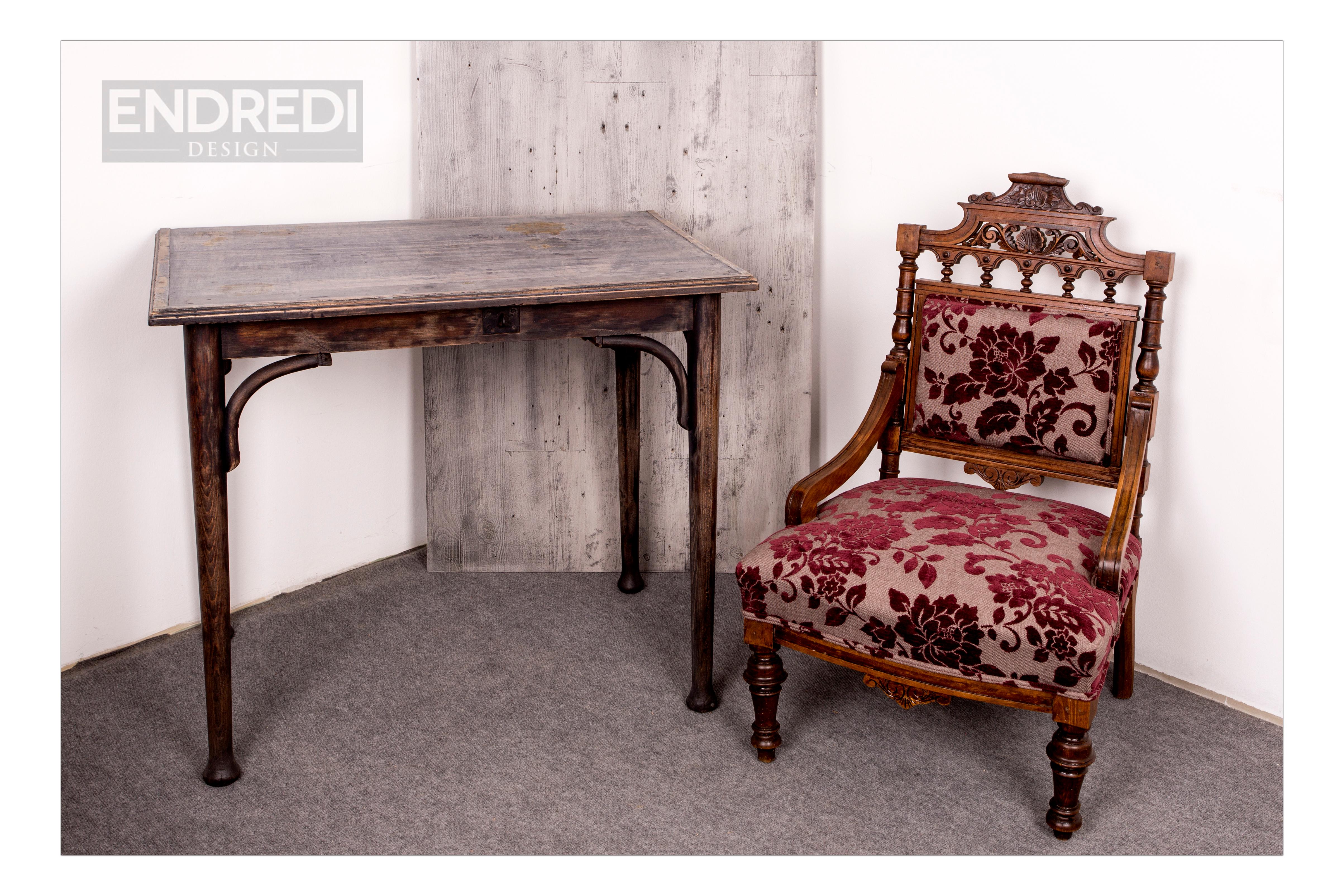 Old German-style armchair with claret fabric. The wooden part stained and lacquered and the upholstery is new.