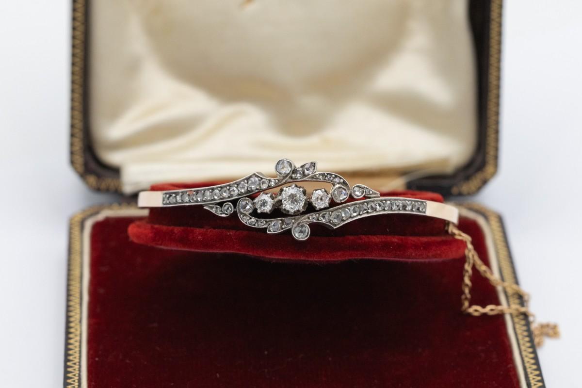 Unique gold bracelet with diamonds. Made of 18-carat yellow gold (0.750 fineness) with silver elements. The central 3 diamonds in an old brilliant cut weigh 0.70ct (H-I color and VS2-SI1 clarity). Additionally, the bracelet is set with 46 rose cut