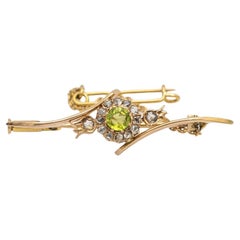 Antique Old gold brooch with olivine and diamonds, Russia, early XX century.