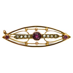 Old gold brooch with tourmalines and pearls