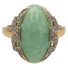 Old gold ring with jade and diamonds in style of Art Deco.