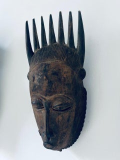 Ancien masque africain Guéré en bois précieux, datant d'environ 1900.