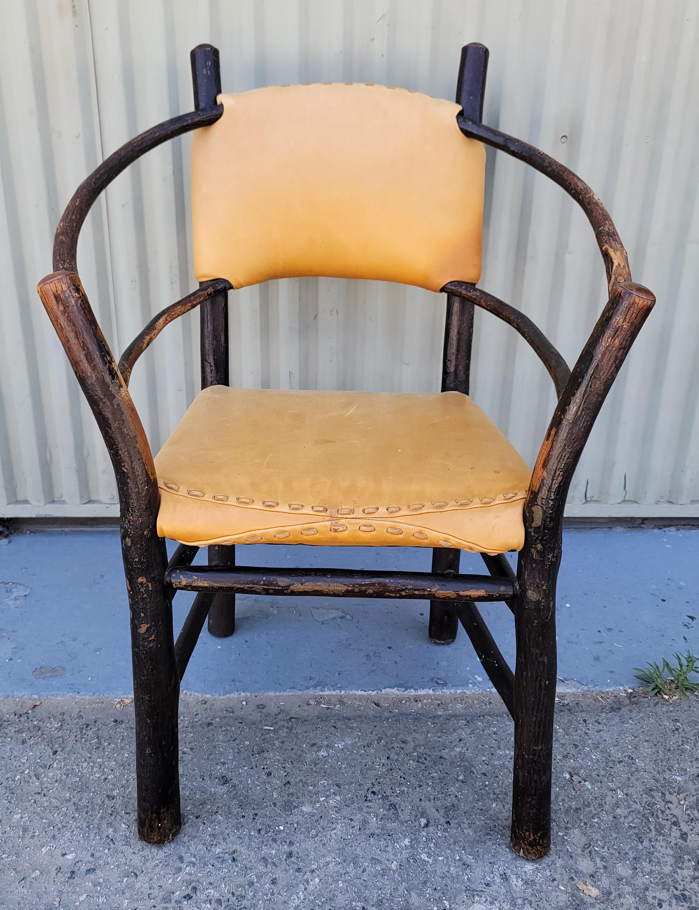 This amazing signed Old Hickory Barrel back chair has a wonderful aged patina and is in very good .sturdy condition.The seat & back are covered in hand sewn vintage leather in fine worn condition.