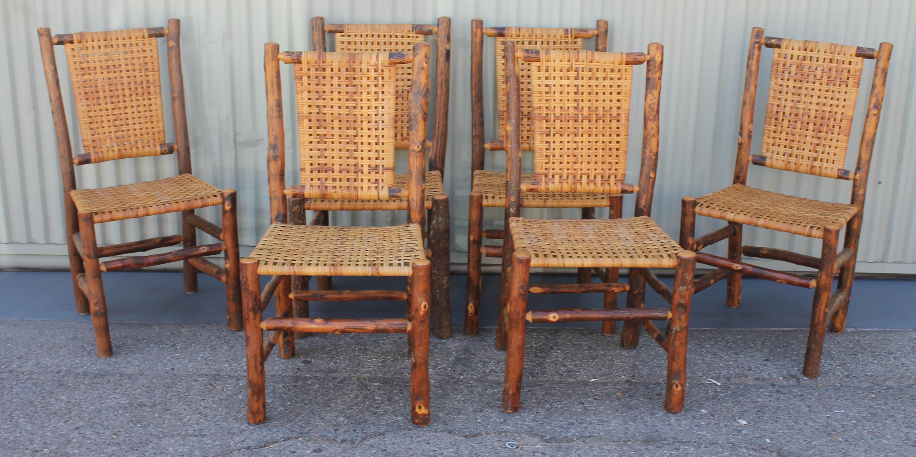 This set of Old Hickory chairs are late but great. Probably from the 1950s or 1960s but in fine condition. The seats and backs are all original.