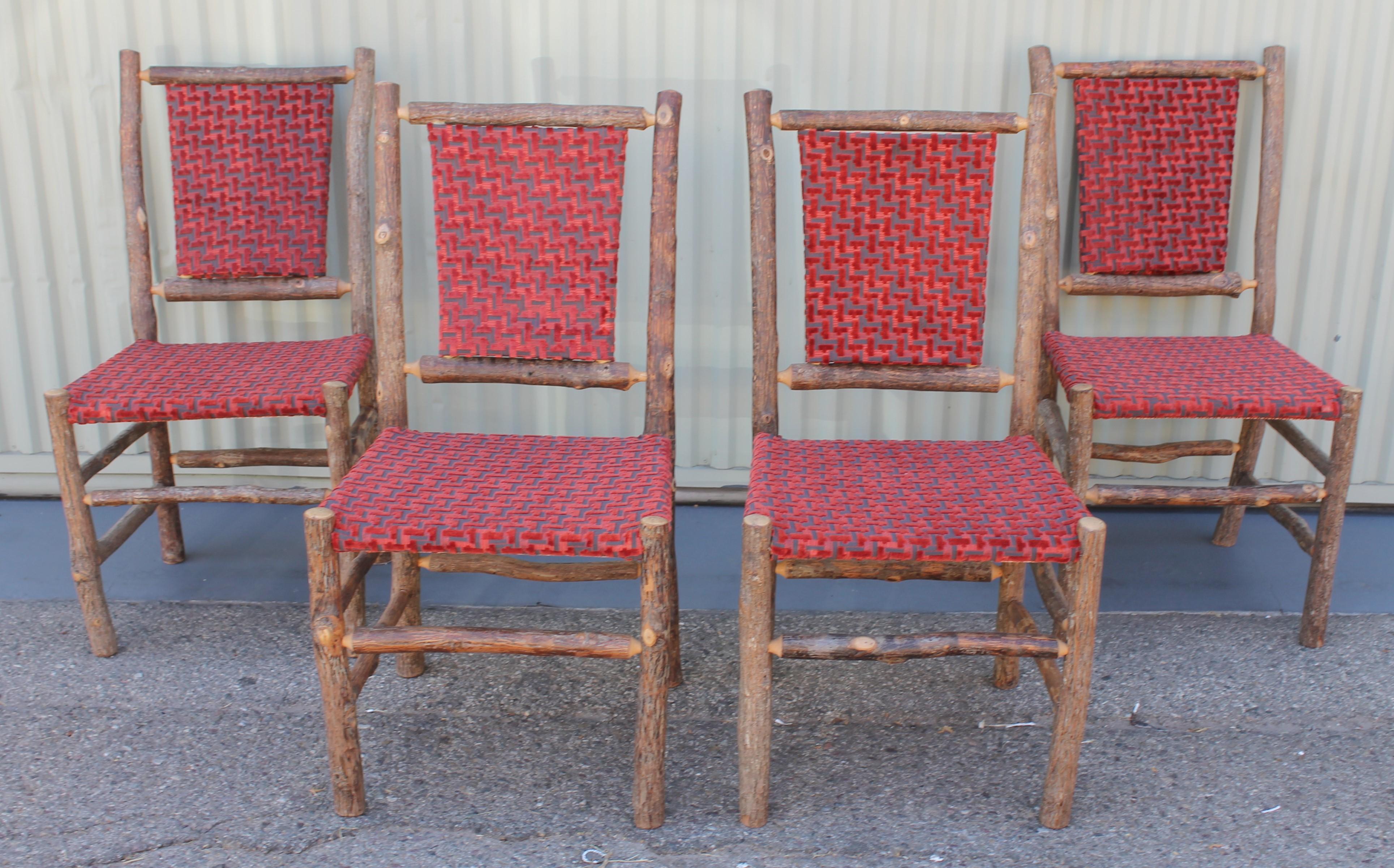 This set of matching Old Hickory chairs from Martinsville, Indiana are in pristine condition and upholstered in a red striped cord fabric. They are very sturdy and comfortable.