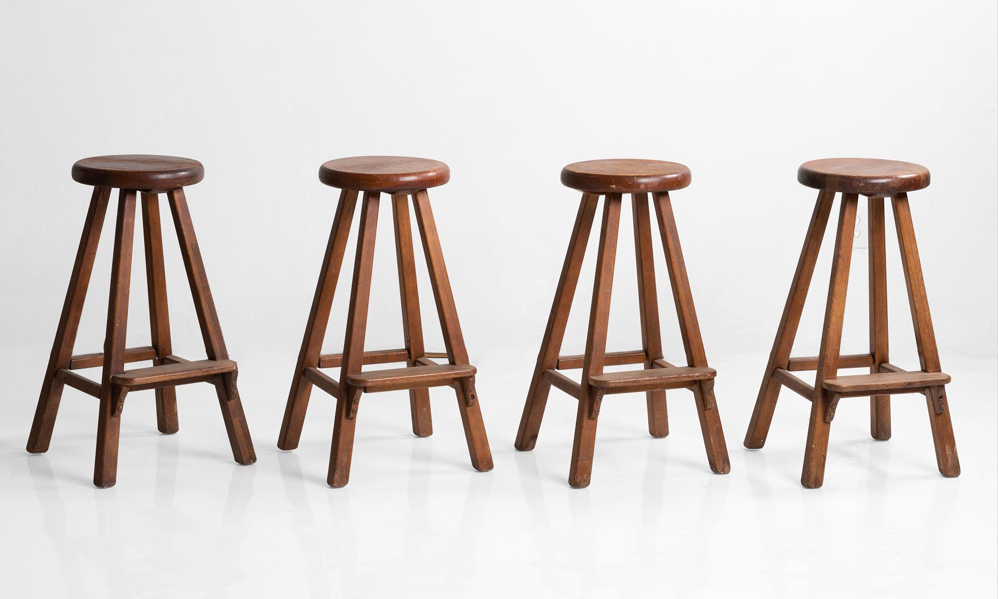 Old hickory maple stools, North America, 20th century.

Four legged stool with round seat and footrest. 

Made in Martinsville, Indiana.