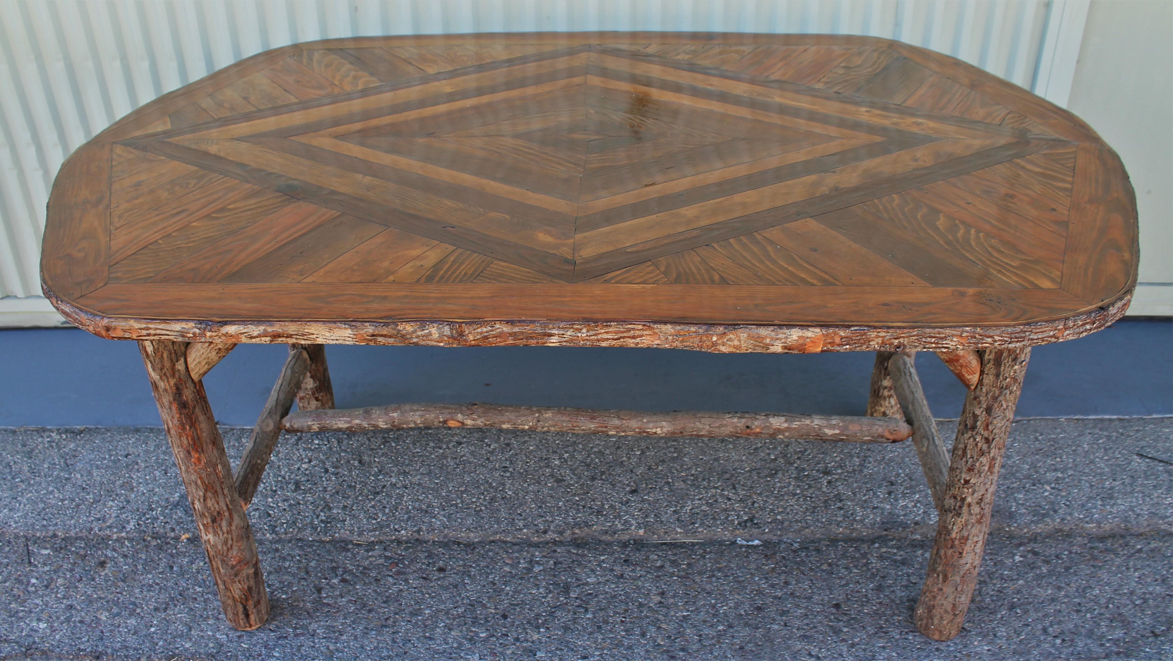 Old Hickory dining table with inlaid wood tabletop. The condition is very good , strong and sturdy. Great form and condition.