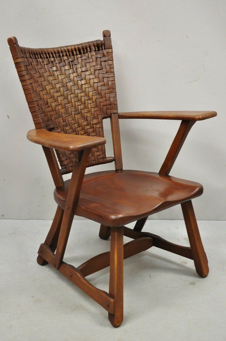 Old hickory paddle arm American provincial woven arm chair Martinsville. Item features a finely woven back, wood plank seat, solid wood construction, original labels, very nice antique item, quality American craftsmanship. Circa Early to Mid 20th