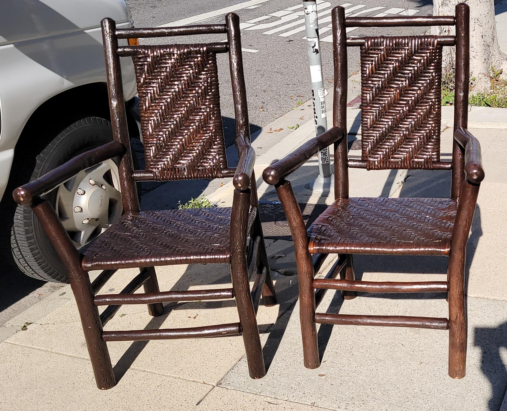 1930's Old hickory arm chairs in a dark varnished finish. The condition are pristine and very sturdy. Signed Old Hickory Furniture Company from Martinsville,Indiana. Sold as a matching pair.
