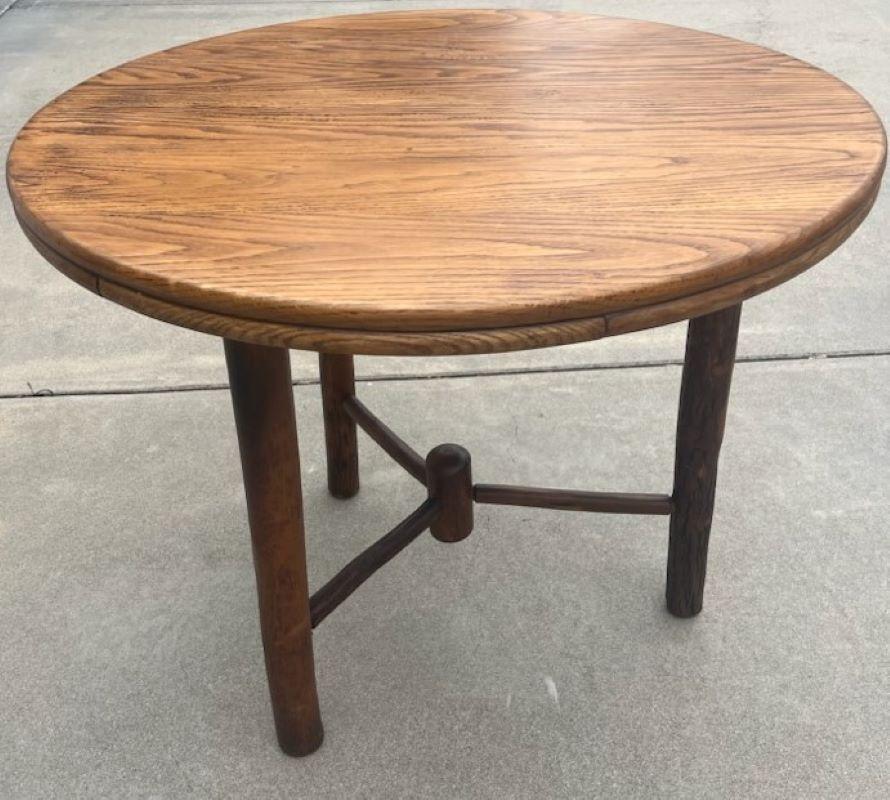 Early 20th century round hickory dining table. Old hickory manufacture. Has been sealed to protect wood from all weather. This item has been checked for strength and stability.It has a wonderful original old surface & nice patina.