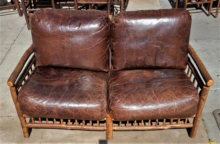 Custom Made Old Hickory sofa with distressed leather cushions. This sofa would be great in a country or Ranch Home.