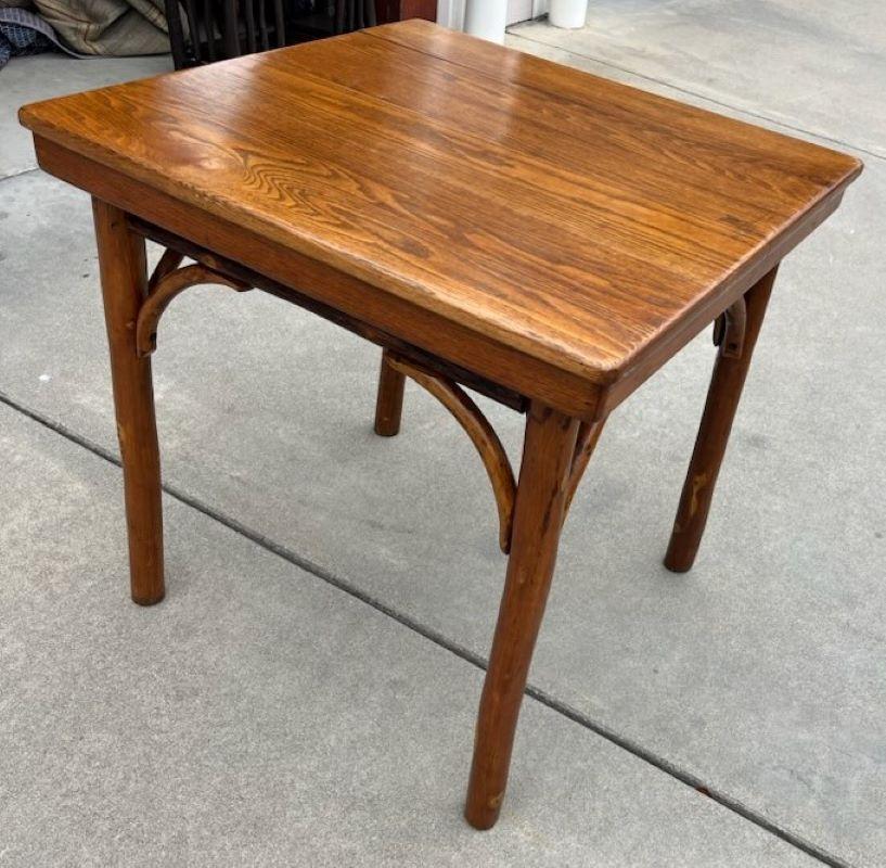This amazing signed Old Hickory dinning or game table is in fantastic condition.It has a wonderful mellow patina with original old varnished surface.It is very tight and sturdy.Great for a breakfast table or card table for your ranch or man cave.