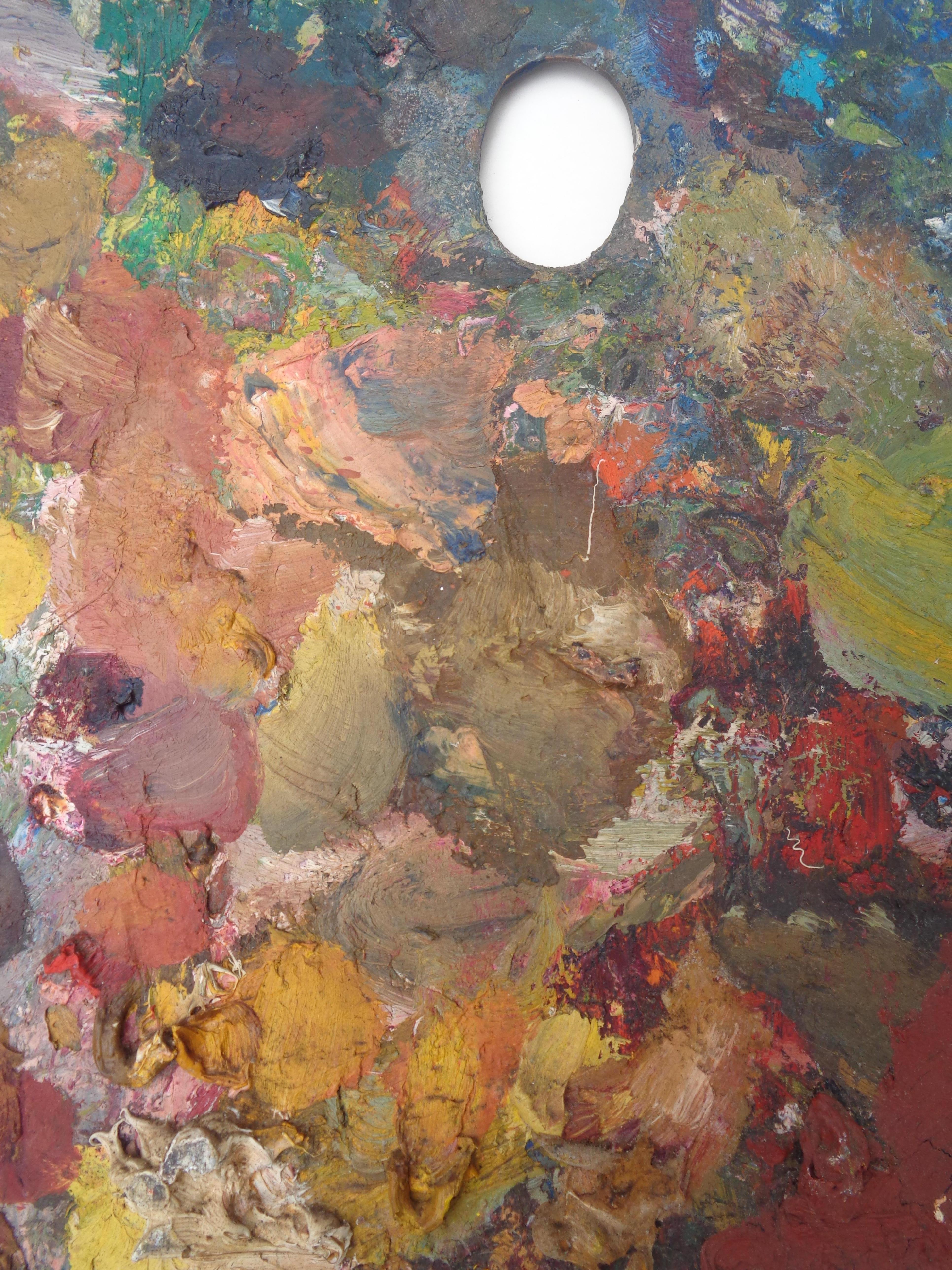 Vecchie tavolozze per artisti in legno incrostate di pittura 1