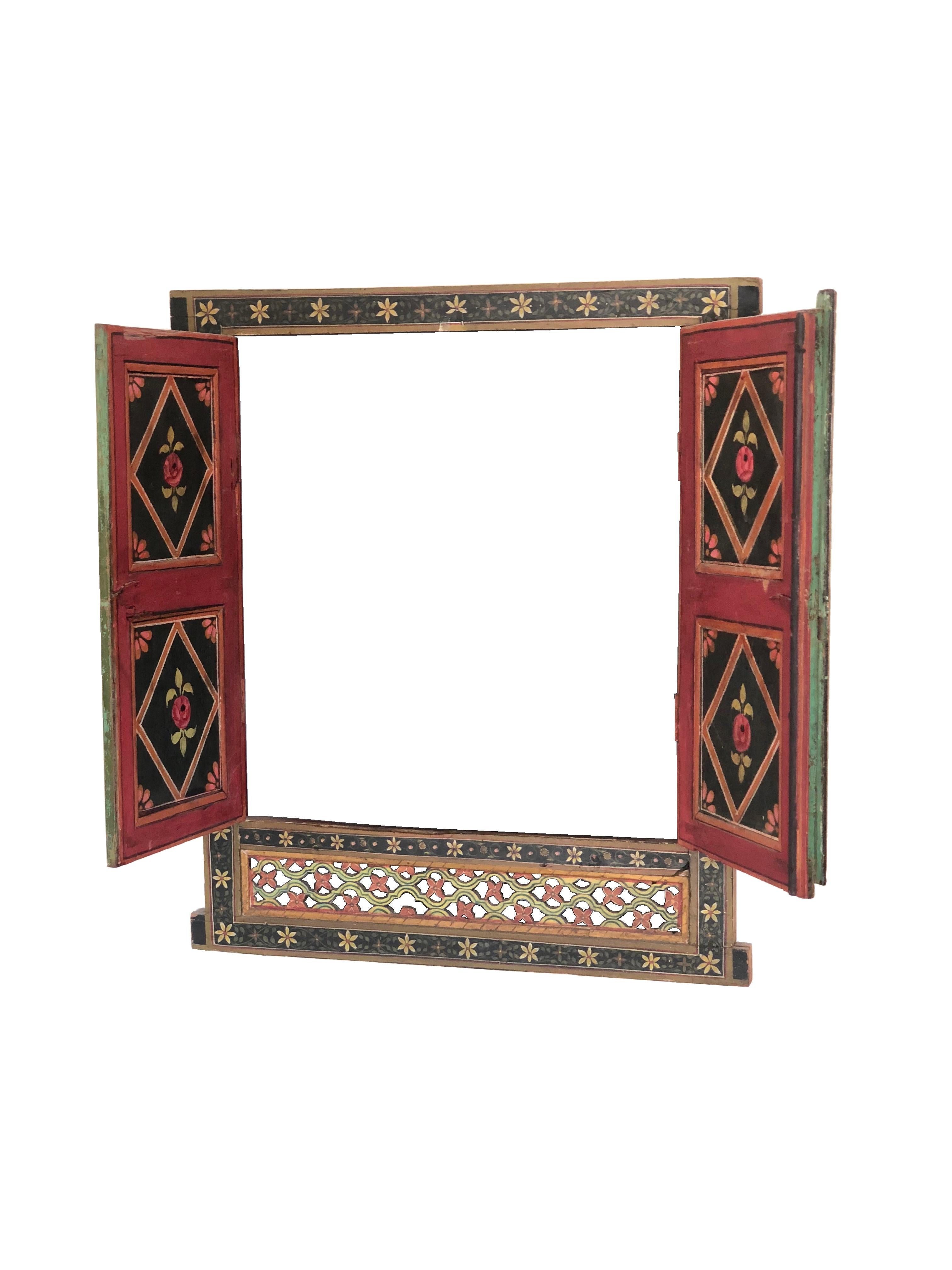 Original ancient Indian window depicting two dancers, a female and a male, intent in their moves and in typical customs. Floral themes in the frame. The window is made of hand painted and hand carved wood.
Perfect to be used as ornamental in the