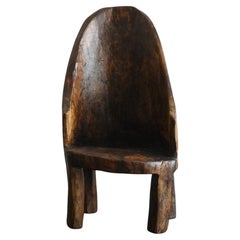 Old Indian wooden low chairA/20th century/Chair made from a single piece of wood