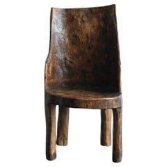 Old Indian wooden low chairB/20th century/Chair made from a single piece of wood