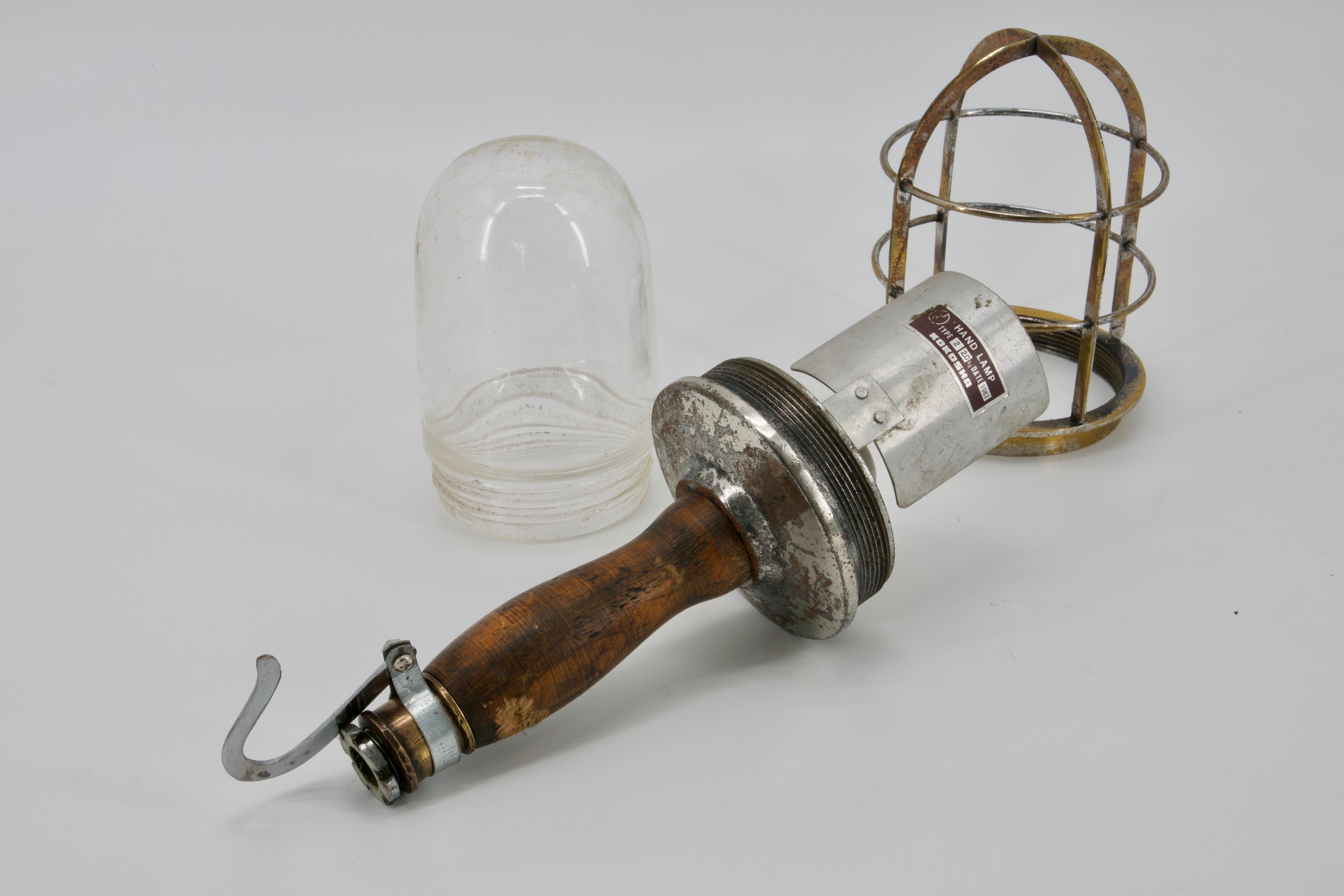 Old Industrial Task Light with a Steel Cage, Wood Handle and a Steel Hook In Distressed Condition For Sale In Crespieres, FR