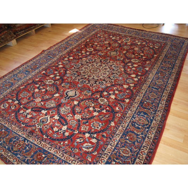 Old Isfahan carpet, of superb classic design with outstanding colours.

The carpet is of very fine weave with tight fine pile of lambs wool. The carpet has a velvet like feel.

The carpet has a floral lattice all over design and has amazing