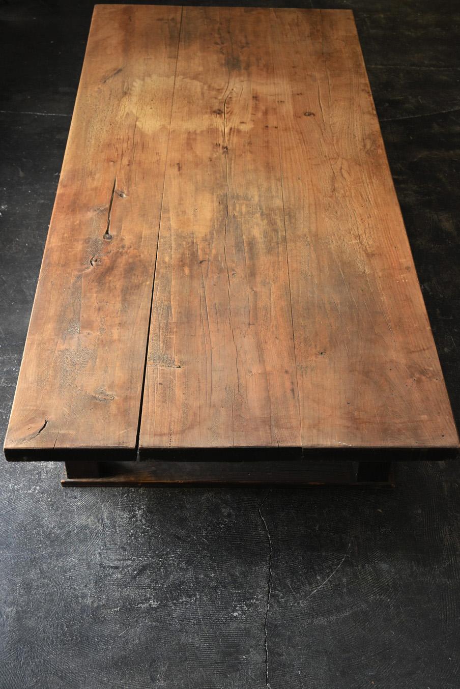 This is a charming wooden table crafted in Japan around the 20th century. The tabletop is likely made from horse chestnut wood, while the legs are crafted from cedar. Finished by Japanese woodworking artisans, this table beautifully showcases the