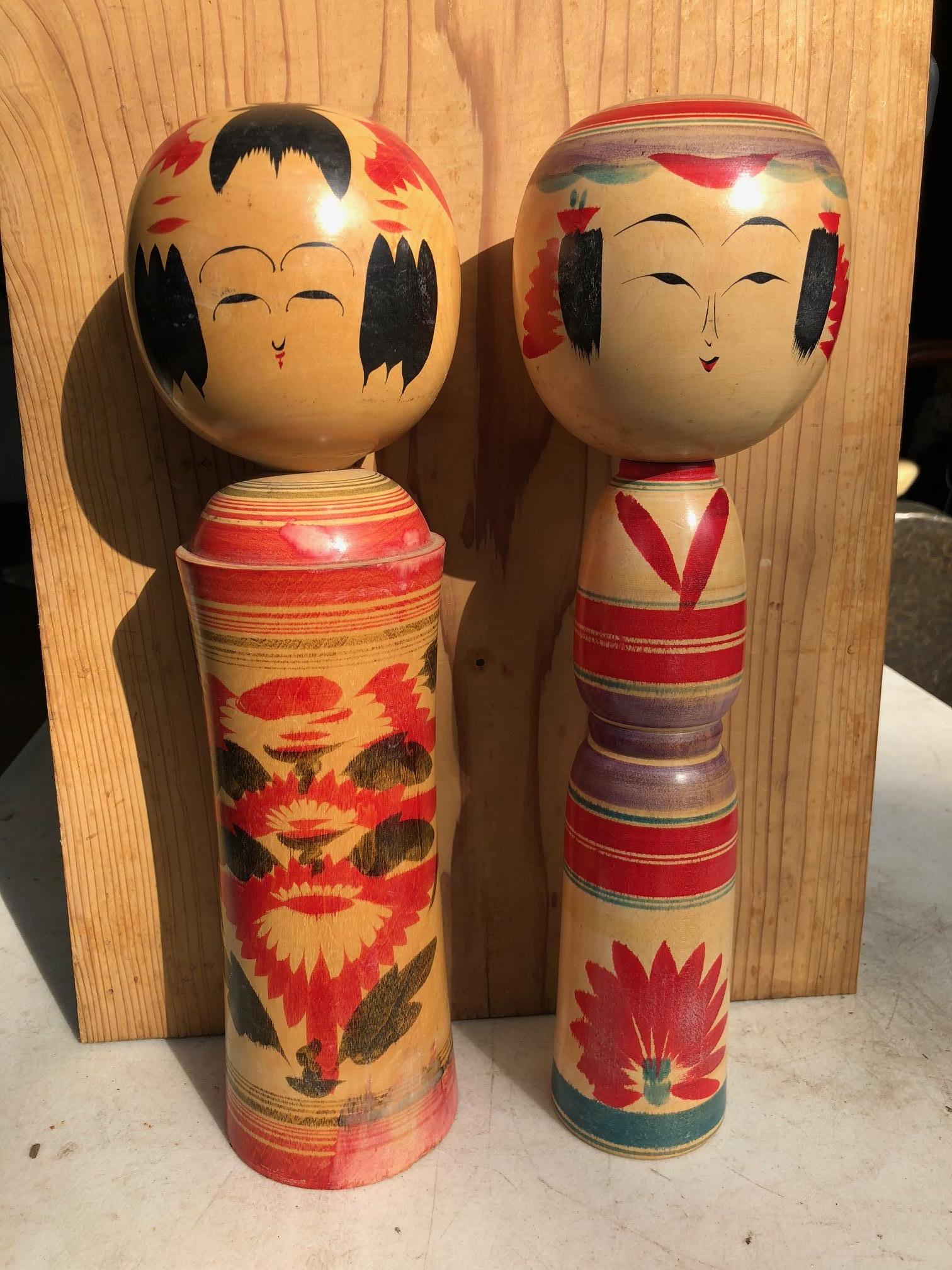 Tall and signed, fine quality, rich vibrant colors

A beautifully preserved pair of Japanese Folk Art surviving tall pair (2) fine hand carved and hand painted Kokeshi dolls one of Japan's most popular antique doll collectibles and unique