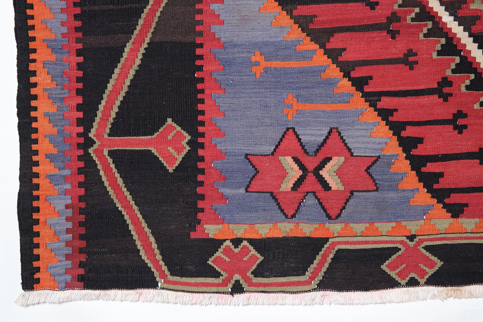 This is a Caucasian Old Kilim from the Kuba region with a red background and beautiful color composition.

Kilim of Kuba, a city in Azerbaijan. It is located by the Caspian Sea, near Dagestan in the north of Azerbaijan. This region is a