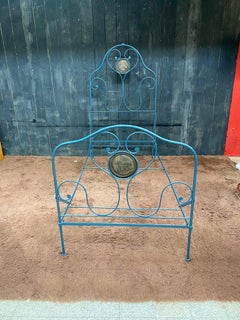 Old lacquered wrought iron bed, coming from a religious congregation circa 1900
