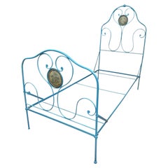 Old lacquered wrought iron bed, coming from a religious congregation circa 1900