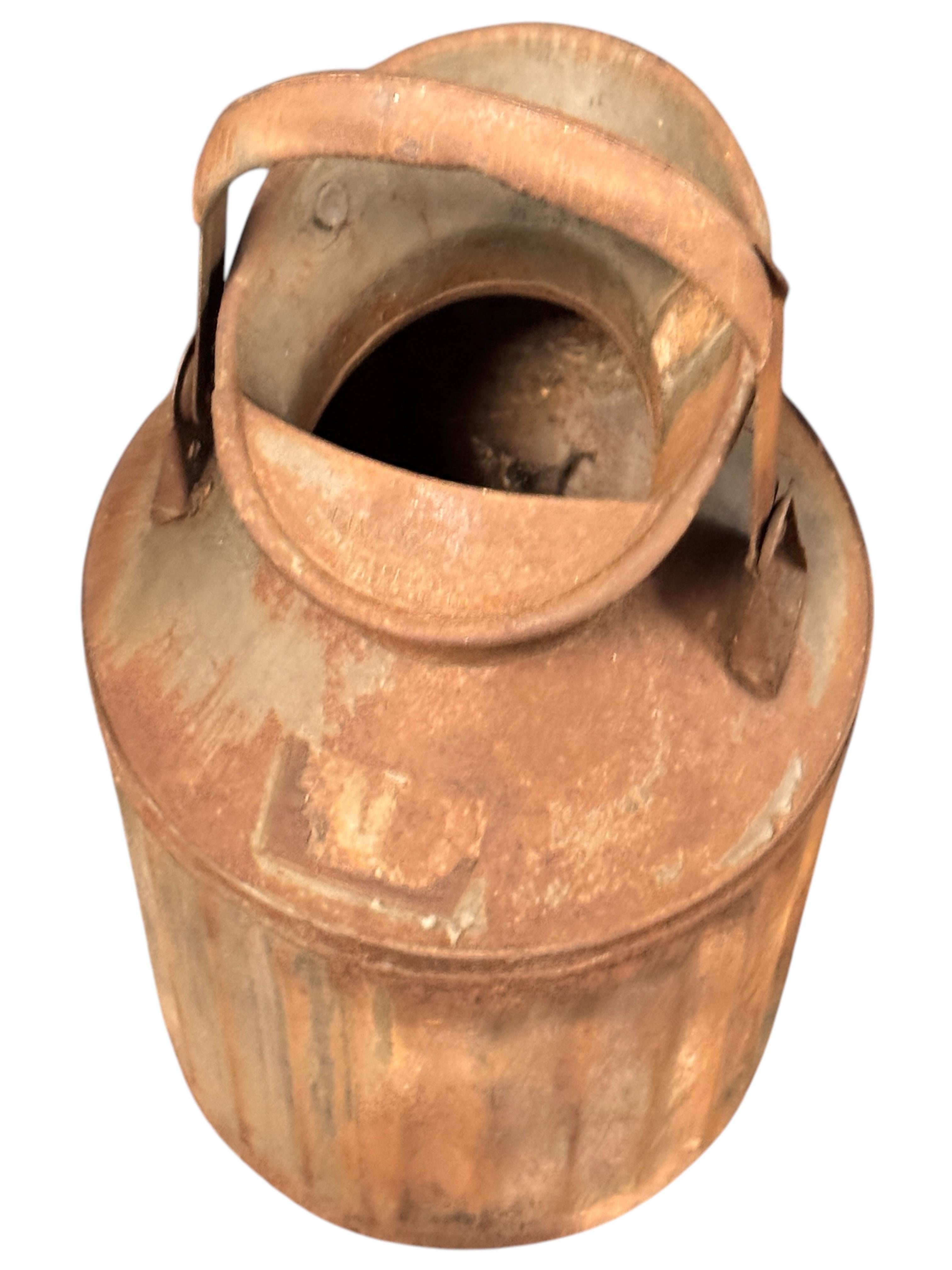 Antique Petroliana find 5 gallon zinc galvanized metal gas and oil can. Condition shows some dents and dings present. Vintage patina with rusty finish. A great piece for your garage, shop, or farmhouse porch decor. Easily top with a basket of