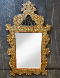 Old large oriental mirror in engraved and polychromed wood; beveled mirror