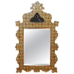 Old large oriental mirror in engraved and polychromed wood, beveled mirror