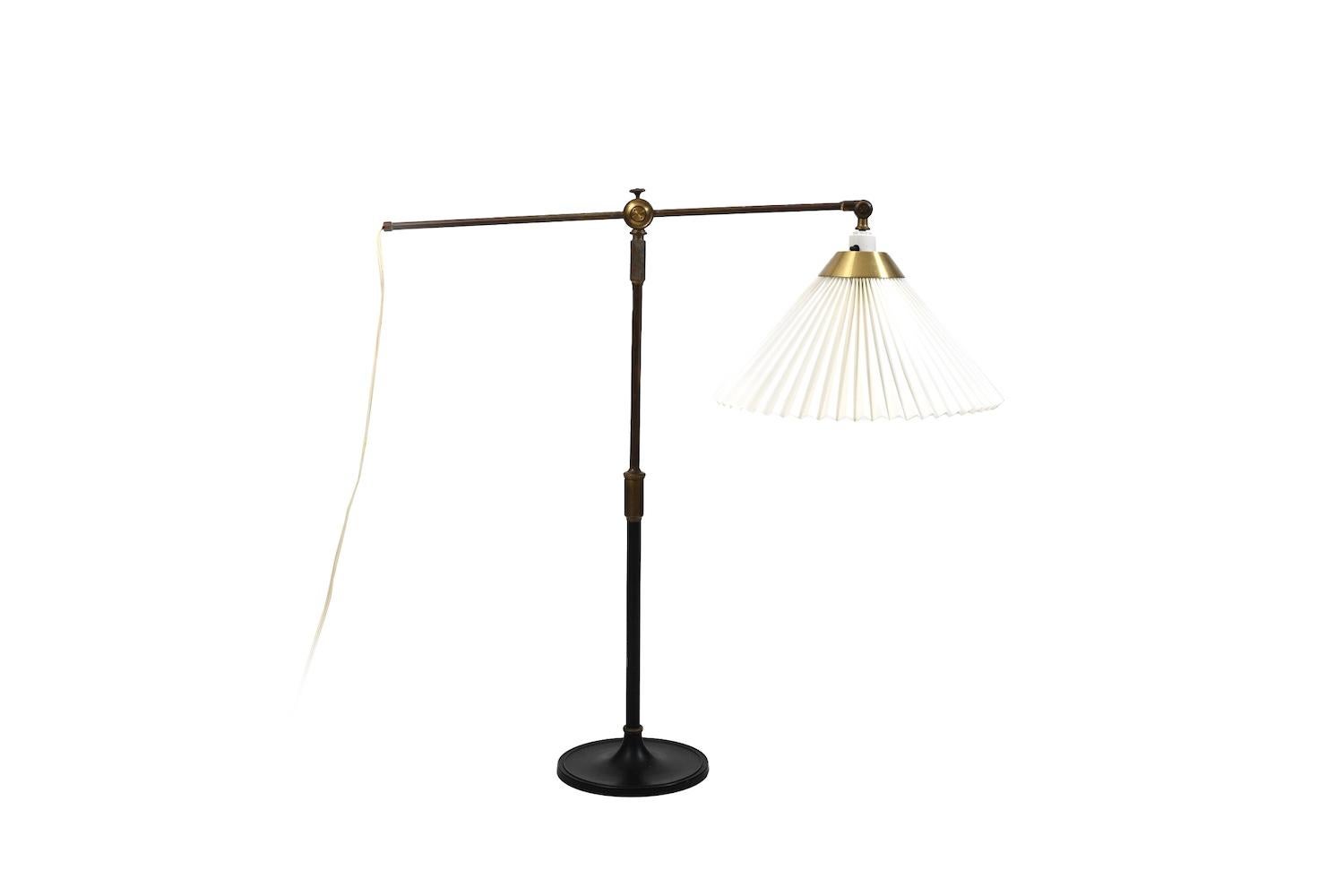 Telescopic table lamp, model no.338 by Aage Petersen for Le Klint. Denmark, 1930s. Black lacquered metal and brass. Adjustable frame.