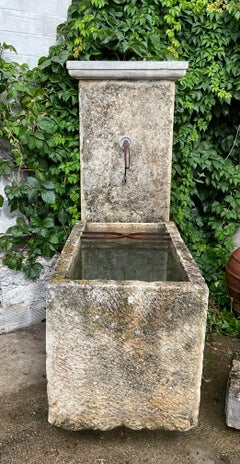 Old limestone wall fountain