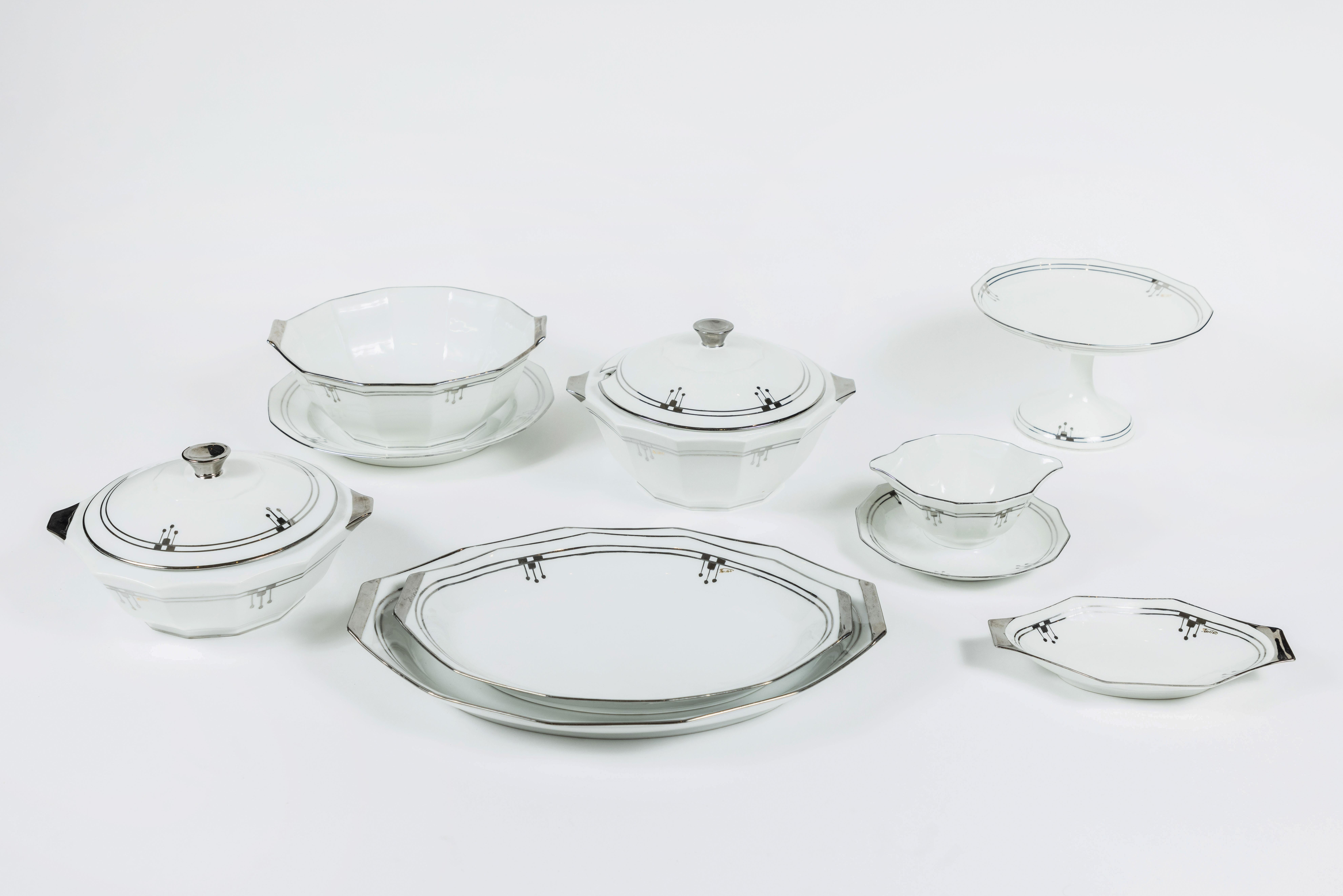 Here is an elegant old Limoges 'Unique' China set of 9 serving pieces in a bold Art Deco style - clean white china with shiny platinum edge design detailing.
This set includes: covered casserole, tureen, serving bowl, sauce bowl, compote, round