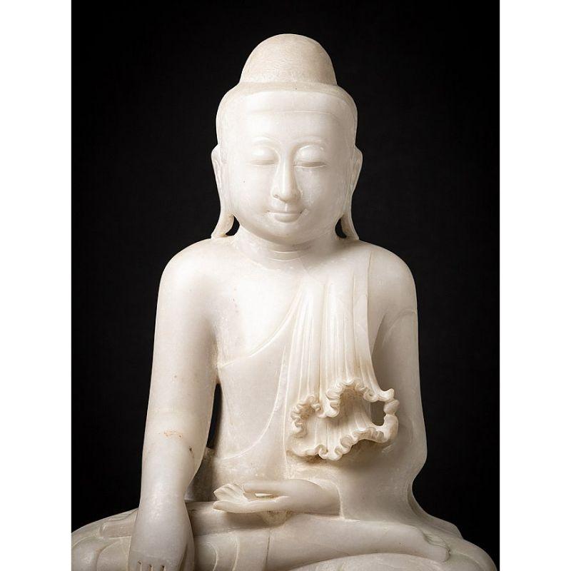 Material: marble
64,5 cm high 
47,5 cm wide and 21 cm deep
Weight: 55.35 kgs
Mandalay style
Bhumisparsha mudra
Originating from Burma
Middle 20th century
Very nice quality !

