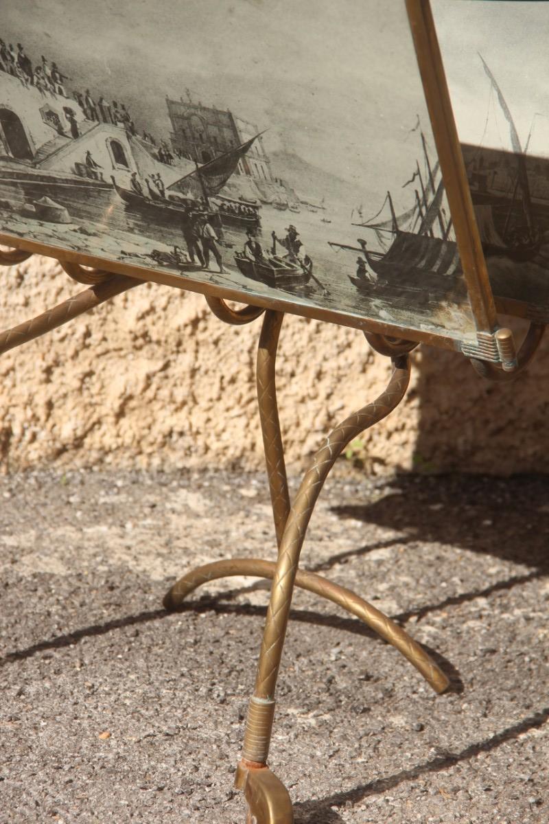 Mid-Century Modern Italian design brass magazine rack and vintage prints, 1950s, Particular form.
On request the brass part can be polished, without any additional cost.