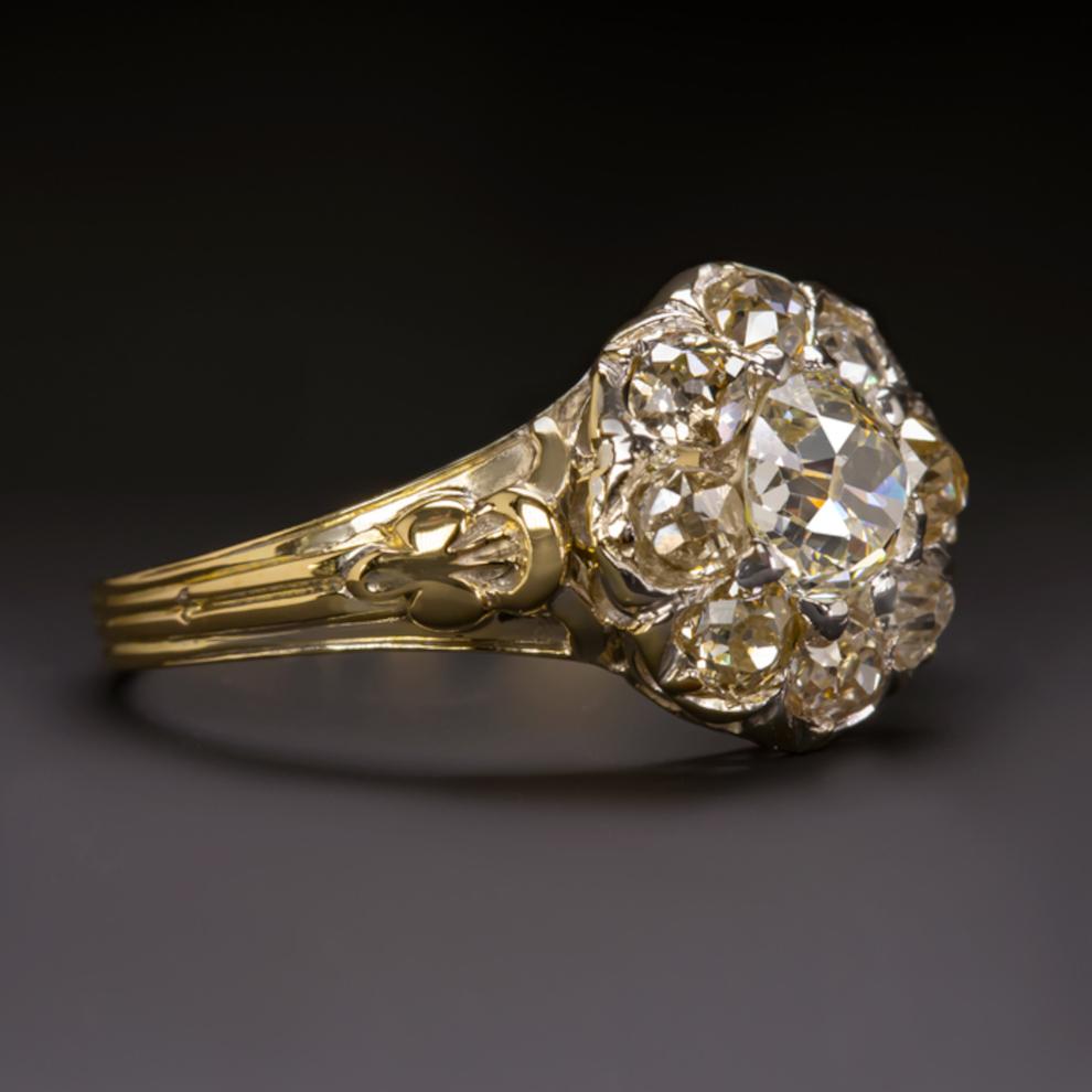 This stunning antique cocktail ring was made during the Victorian era and features over 2.00 carats of beautiful old cut diamonds. In more detail, the central diamond weighs between 0.90 and 1 carat and is I-J graded for color and is of high quality