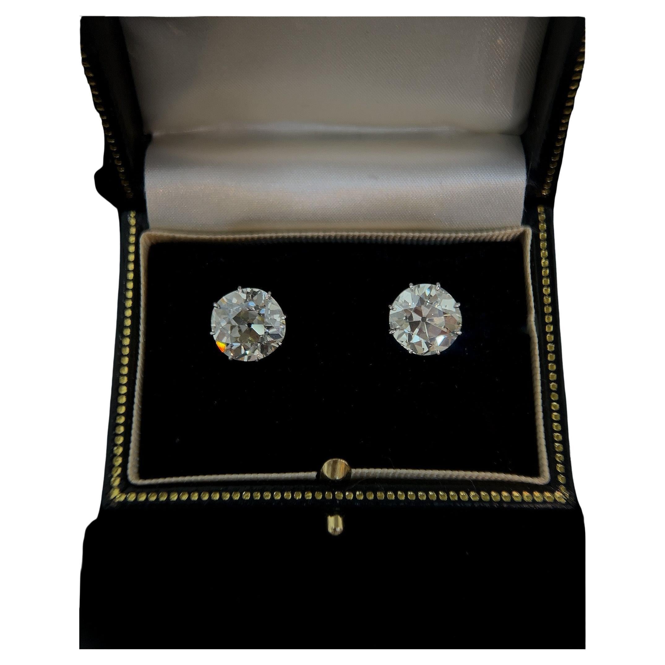 Introducing a rare and exquisite pair of old mine cut diamond earrings, each boasting a stunning 5.60 and 5.10 carats respectively.

The diamonds are circa 1880s (Victorian). The settings are circa 1910.

Set in platinum.  