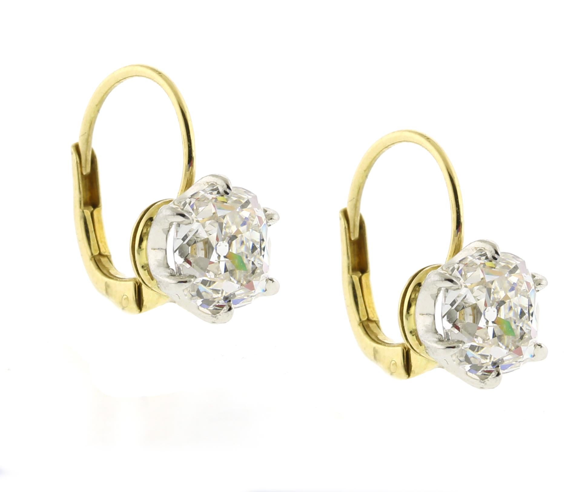 Indulge in the allure of timeless elegance with these exquisite Old Mine Cut Diamond Earrings. Featuring two stunning diamonds weighing 1.66 carats and 1.65 carats respectively, for a total of 3.31 carats, these earrings capture the enchanting