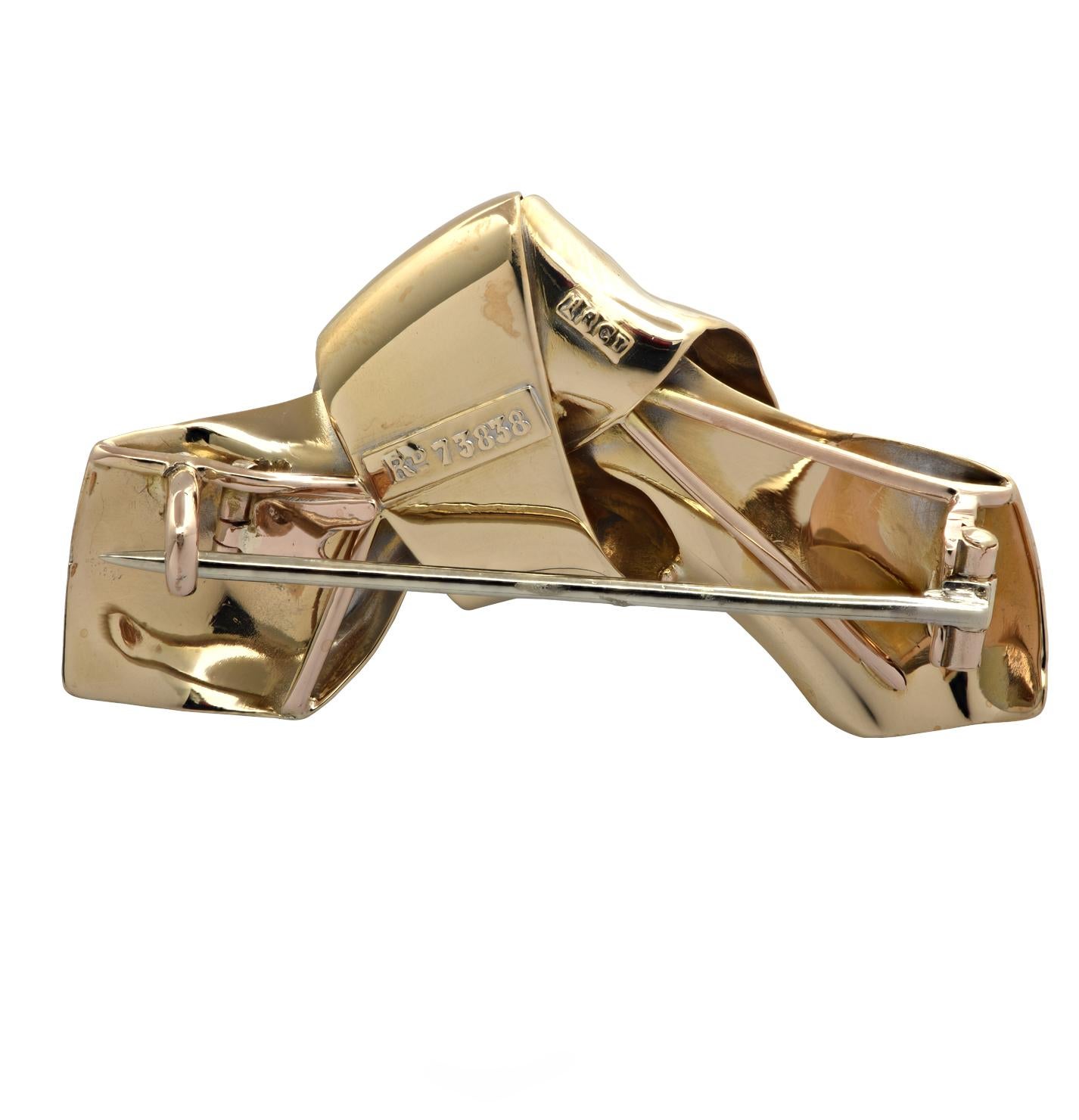 Beautiful Brooch Pin crafted in England in 18 karat yellow gold, showcasing an Old Mine Cut Diamond weighing approximately .35 carats, G-H color, VS clarity. The brooch pin is fashioned into a highly polished ribbon measuring 1.6 inches in length