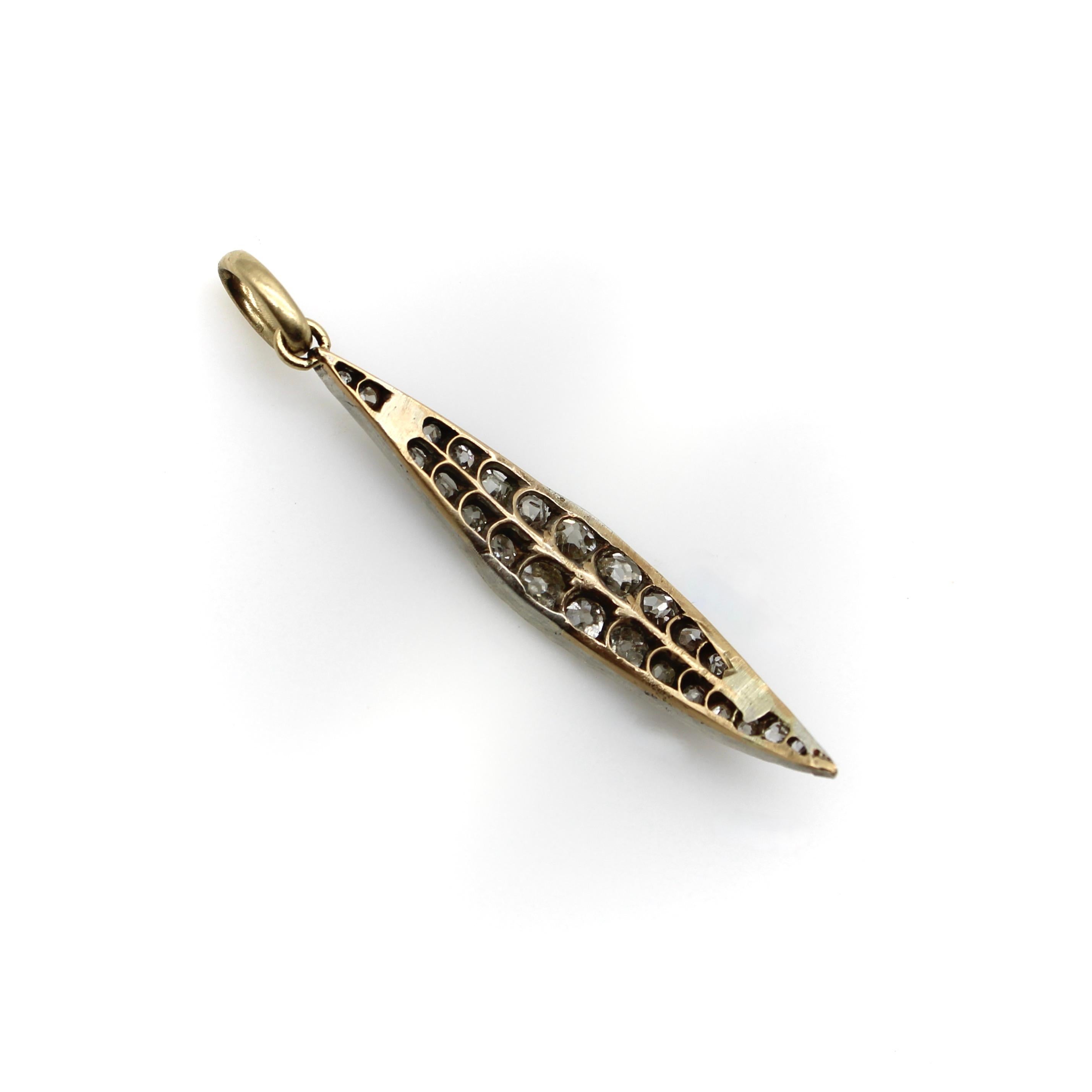 This extraordinary leaf-shaped pendant is studded with gorgeous chunky Old Mine Cut diamonds. We believe this was once part of a tiara and was most likely the shape that adorned the headless. We added an ample size 14k gold bail so that it could be