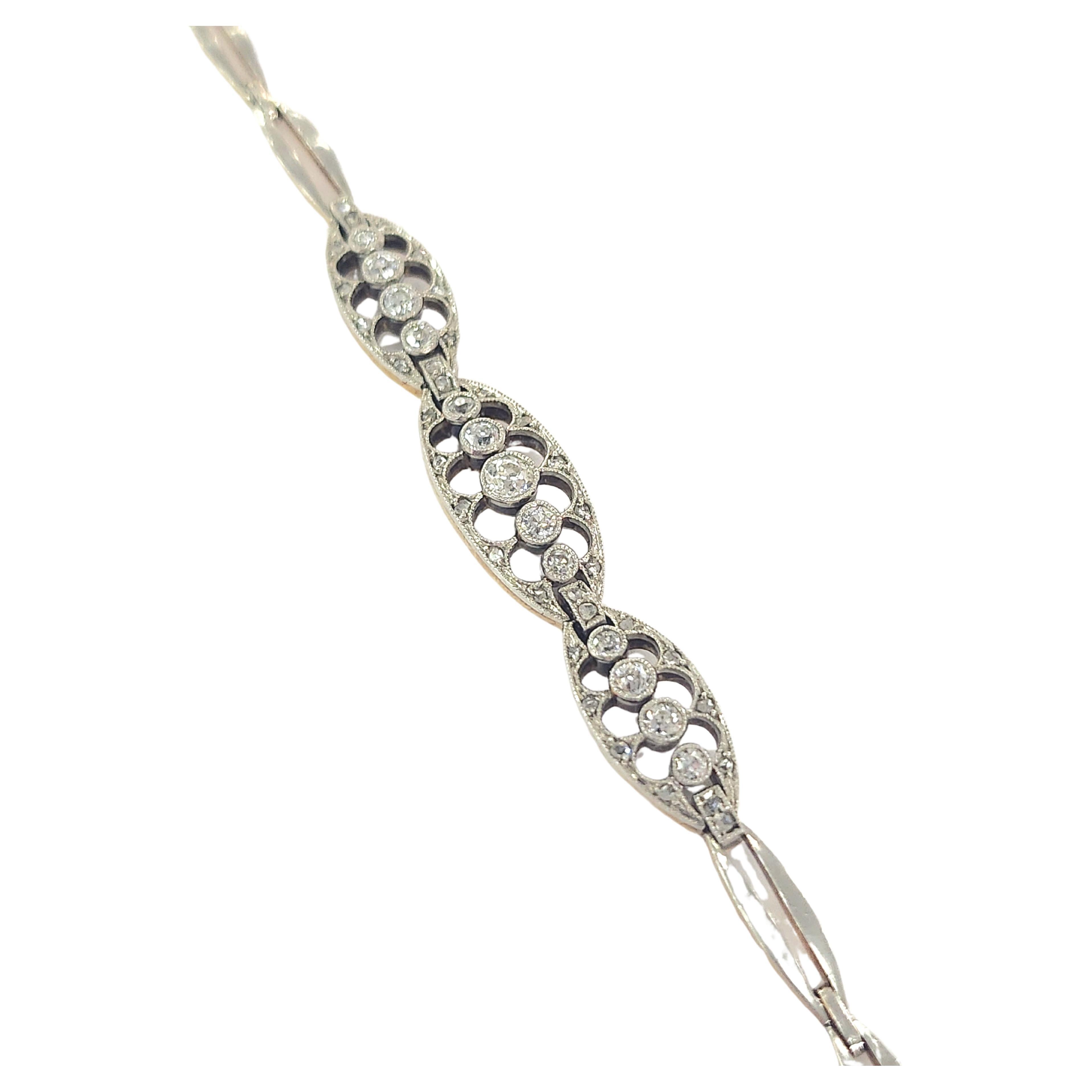 1920s Russian era delicate bracelet made in moscow 1920s in open work style 14k yellow gold topped with platinum centered with old mine cut diamonds estimate weight of 1.20 carats H color white vs clearity excellent spark hall marked 583 14k gold