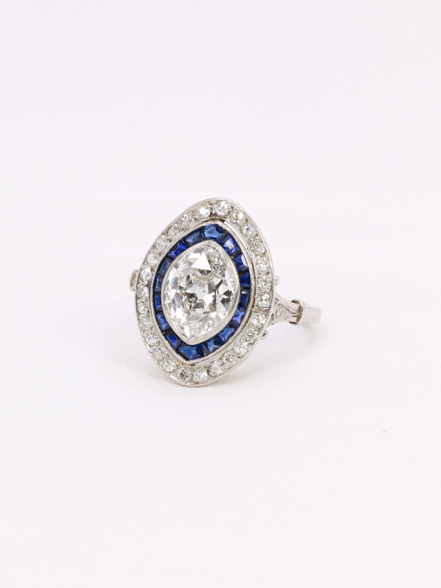 Marquise Cut Old mine cut marquise diamond 2.1 ct Art Deco ring set with calibrated sapphires For Sale